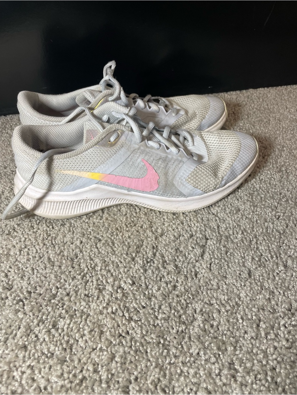 Nike Women's Light Gray Running Shoes with Pink and Yellow Swoosh